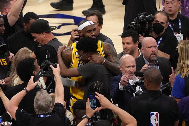 James celebrated the historic night with his family who quickly took to the court to be with him